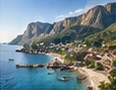 Coastal destination beneath a mountain range